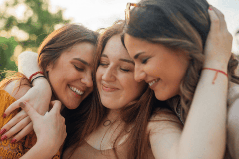 Three Young Women Hugging